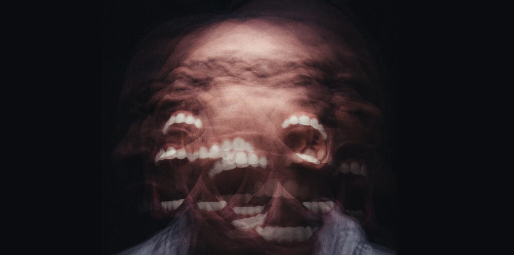 multiple exposure image of an angry person screaming through several mouths