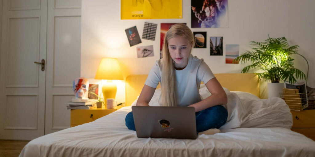 Teenager Using Her Laptop