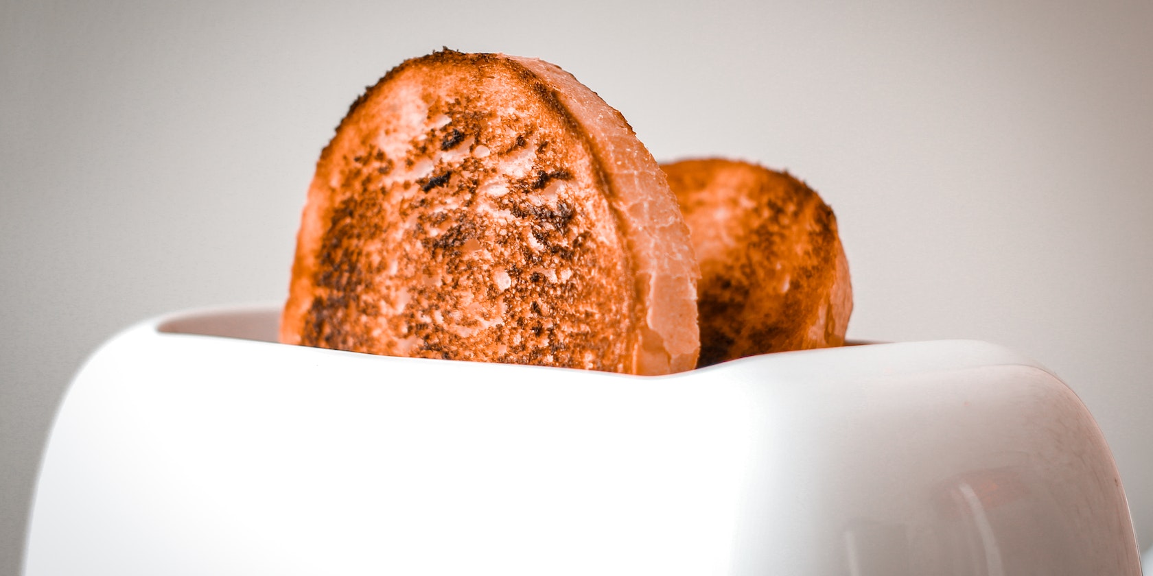 two pieces of toast in a toaster