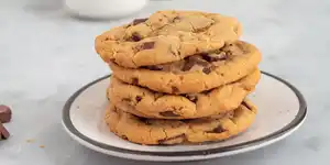 A stack of chocolate cookies on a plate