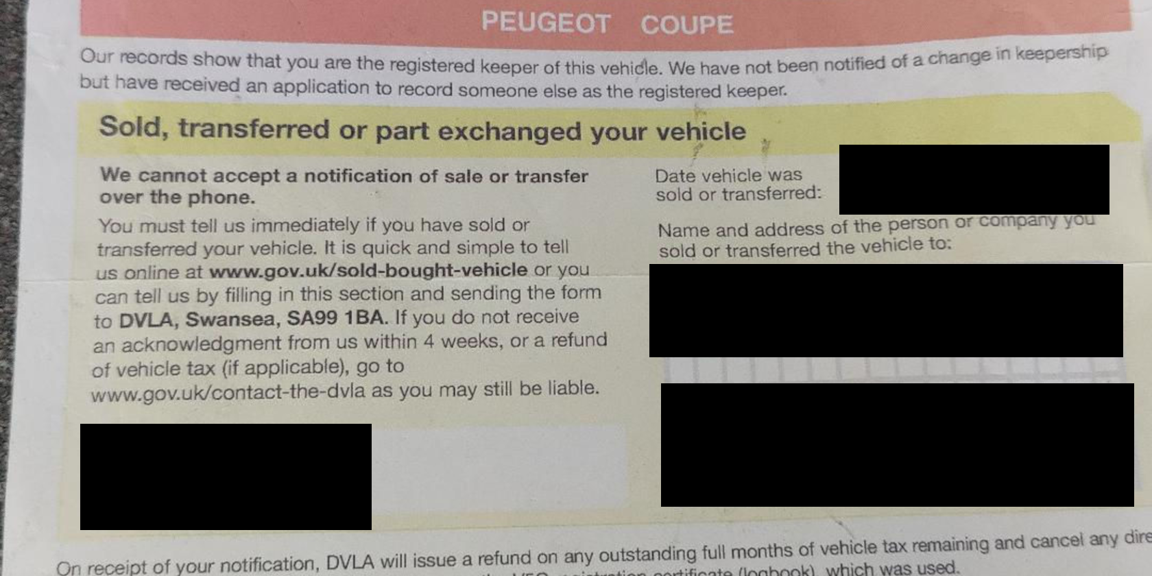 A DVLA document with details blocked by black rectangles