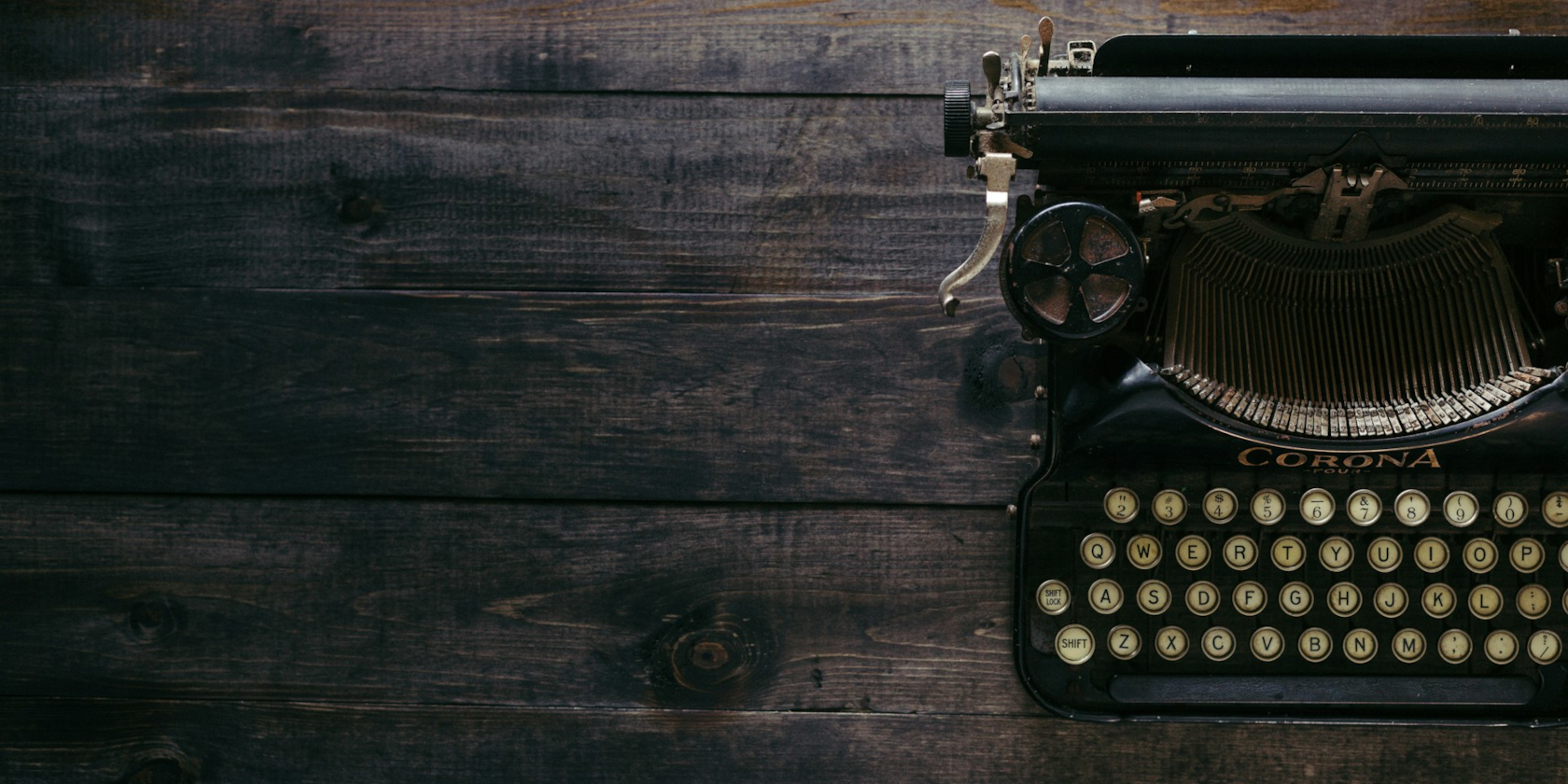 typewriter on a wooden desk